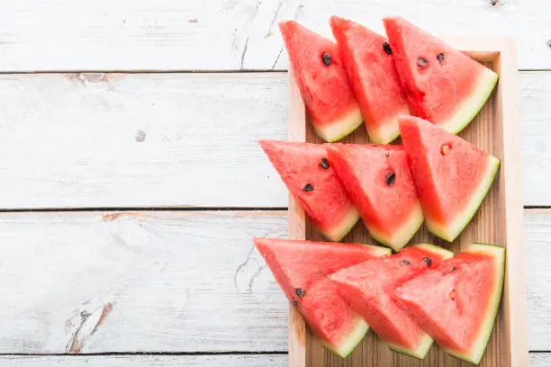 Photo of Watermelon on wooden table background