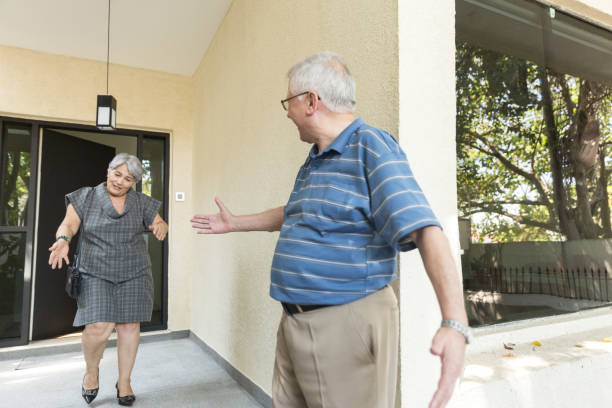 istock Senior Couple Leaving Home For a Walk 1040743506