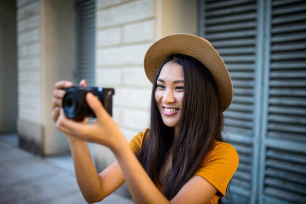 istock Asian girl taking a photo 1040745472