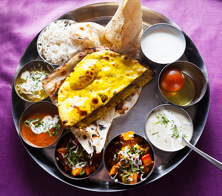 Round metal plate with a selection of Indian Dishes. Rajasthan, India