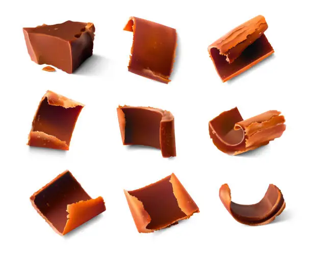 Vector illustration of Realistic chocolate pieces and shavings.