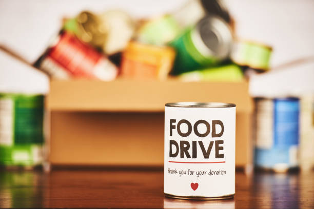 Food Drive Canned Goods Collection with Filled Cardboard Box Food Drive Canned Goods Collection with filled cardboard box canned food stock pictures, royalty-free photos & images