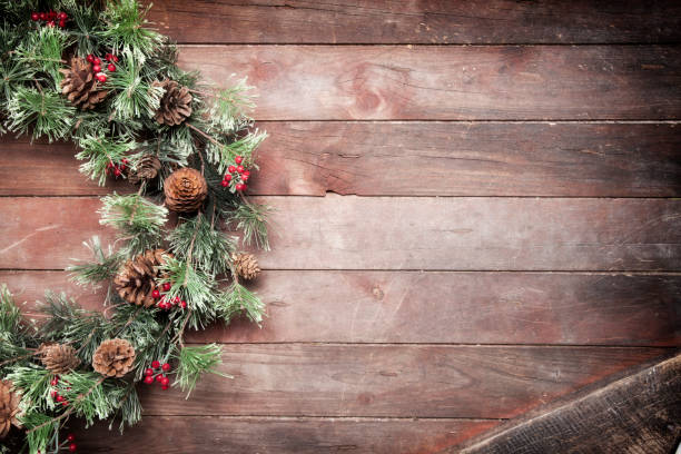 istock Christmas holiday rustic wreath on an old wood background 1040799026