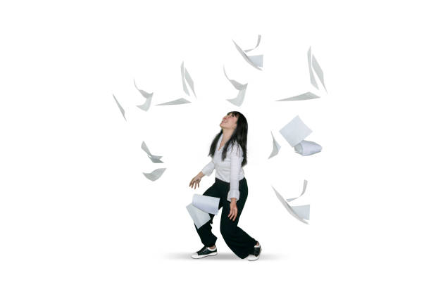 istock Successful businesswoman throwing documents 1040813618