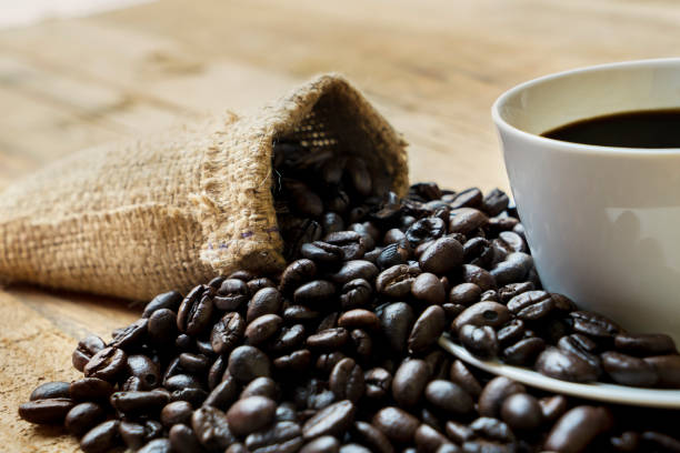 istock Coffee cup with coffee beans and burlap bag 1040814076