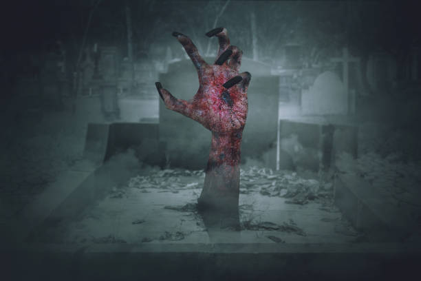 istock Spooky zombie hand with wound on graveyard 1040814434