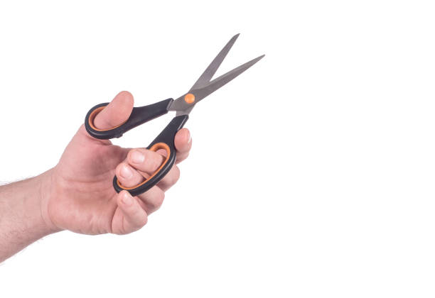 istock male Hand with Scissors. Isolated on white background 1040827850