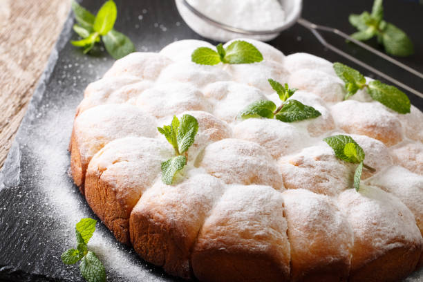 istock Viennese buns buchteln with powdered sugar close-up. horizontal 1040841878