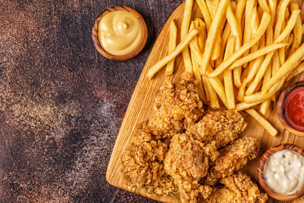 istock Fried chicken wings with french fries 1040846902