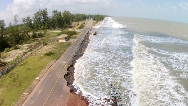 Aerial view road destroy asphalt road  from the sea waves.