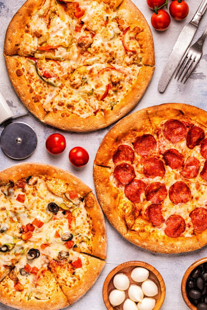 istock Set of different pizzas - pepperoni, vegetarian, chicken with vegetables 1040850326