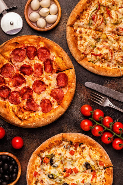 istock Set of different pizzas - pepperoni, vegetarian, chicken with vegetables 1040850402
