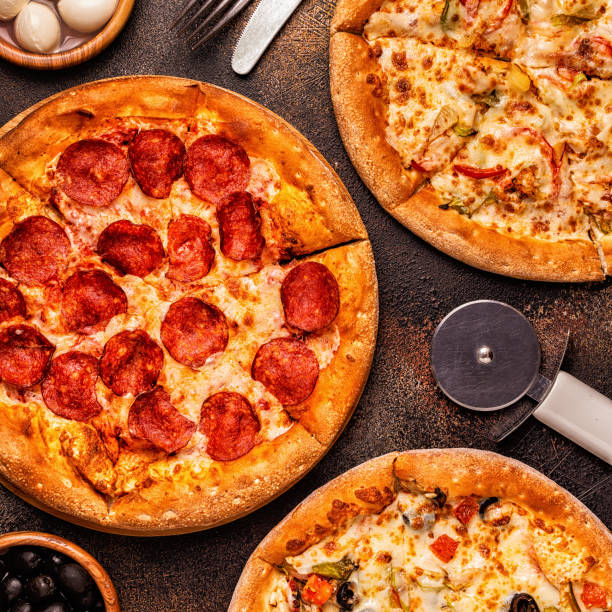 istock Set of different pizzas - pepperoni, vegetarian, chicken with vegetables 1040850406