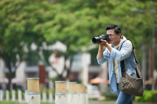 istock Photographer working in park 1040853008