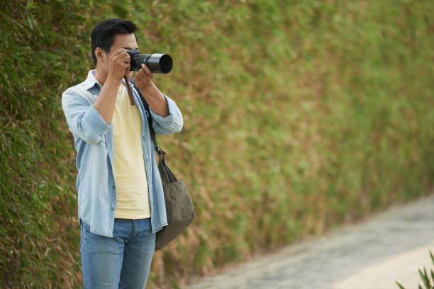 istock Photographer working outdoors 1040853012
