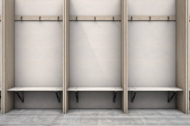 Empty Change Room Cubicles Empty wooden cubicles with a bench and hangers in a rundown sports locker change room - 3D render locker room stock pictures, royalty-free photos & images