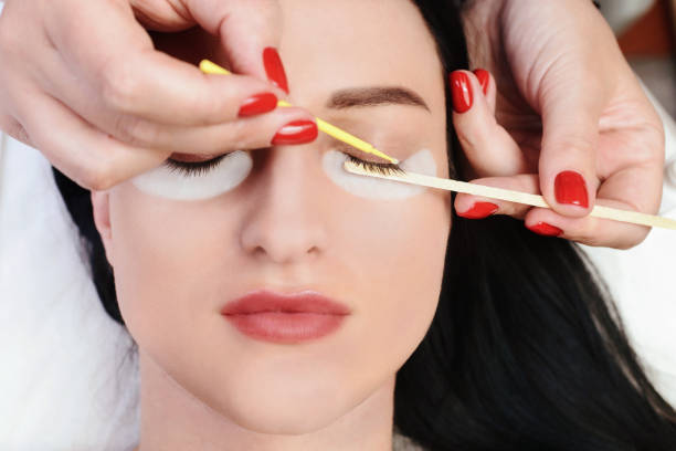 istock Eyelash Extension Procedure. Woman Eye with Long Eyelashes. Lashes, close up, macro, selective focus 1040859522