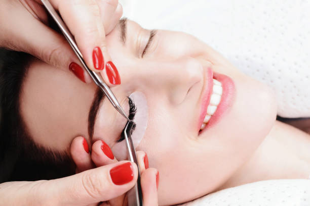 istock Eyelash Extension Procedure. Woman Eye with Long Eyelashes. Lashes, close up, macro, selective focus 1040859804