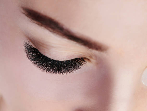 istock Eyelash Extension Procedure. Woman Eye with Long Eyelashes. Lashes, close up, macro, selective focus 1040859912