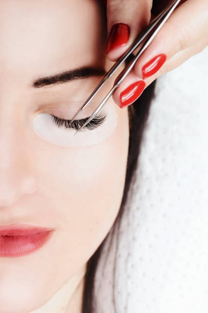 istock Eyelash Extension Procedure. Woman Eye with Long Eyelashes. Lashes, close up, macro, selective focus 1040859962