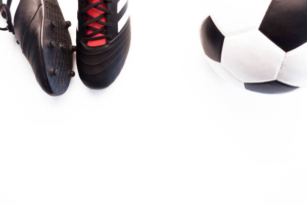 istock Soccer ball, cleats, on white background. Studio shot .Flat lay, top view 1040859974