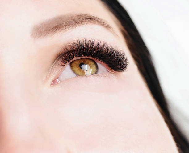 istock Eyelash Extension Procedure. Woman Eye with Long Eyelashes. Lashes, close up, macro, selective focus 1040860170