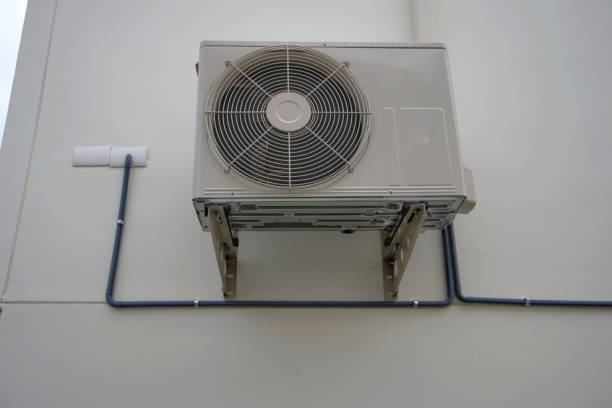 istock air conditioner outdoor unit or heat Pump Compressor or Condenser Fan for support Air Conditioner in home or house. 1040864458