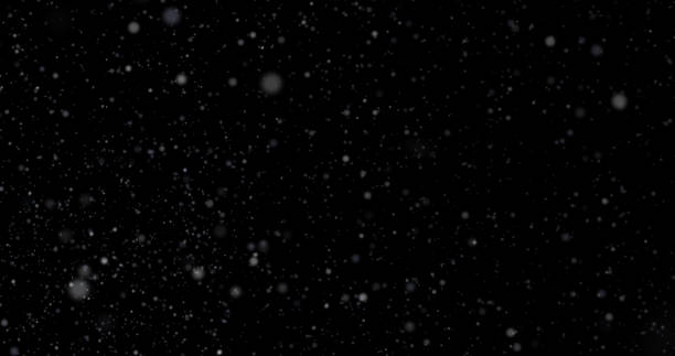istock Natural white winter snowfall on a black background 1040872908