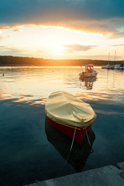 istock Boat at sunset in Adriatic sea 1040881440