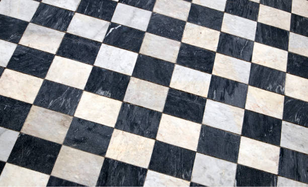 istock Antique checkered marble floor, black and white tiled background 1040885868