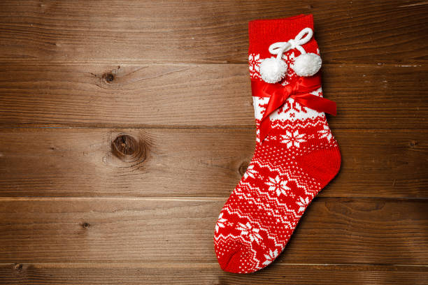 istock Christmas red sock on a wooden wall 1040892198