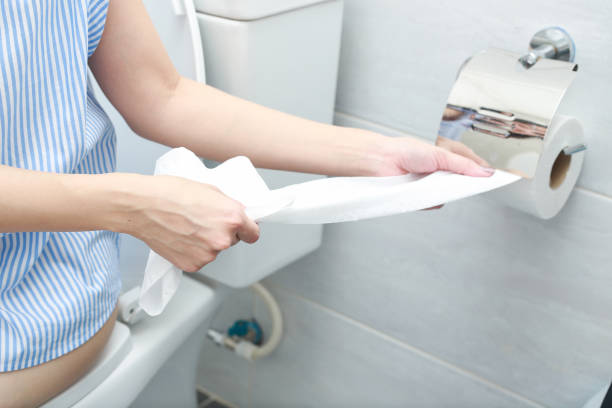 istock Close-up of a hand using toilet paper. 1040892350