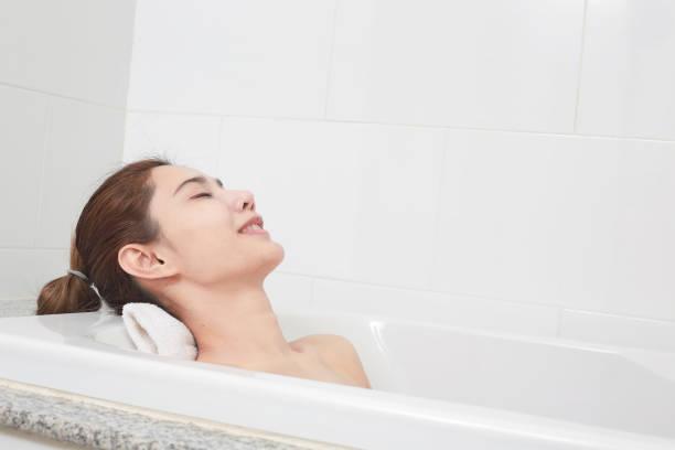 istock Just relax. Content beautiful young woman relaxing while taking a bath. 1040897202