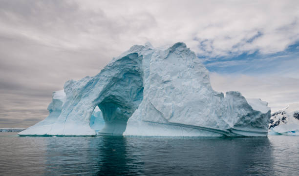 istock Arched and weathered iceberg, Antarctic Peninsula 1040900414