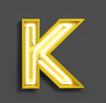 Bright Neon Font with fluorescent yellow tubes. Letter K. Night Show Alphabet. 3d Rendering Isolated on Dark Background.