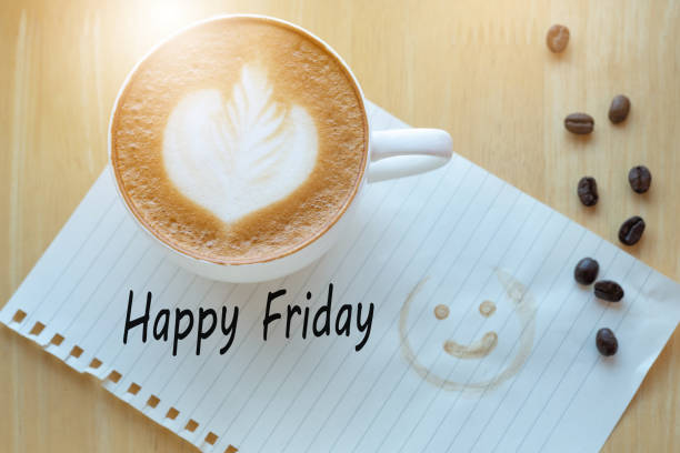 istock Concept Happy firday message on notebook, pencil and coffee cup on wooden table. 1040901448