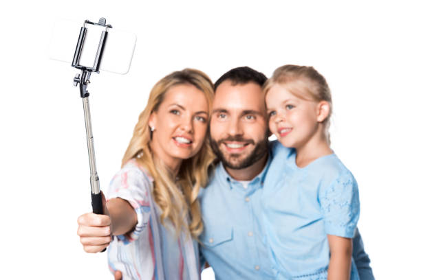 istock happy family taking selfie isolated on white 1040903028