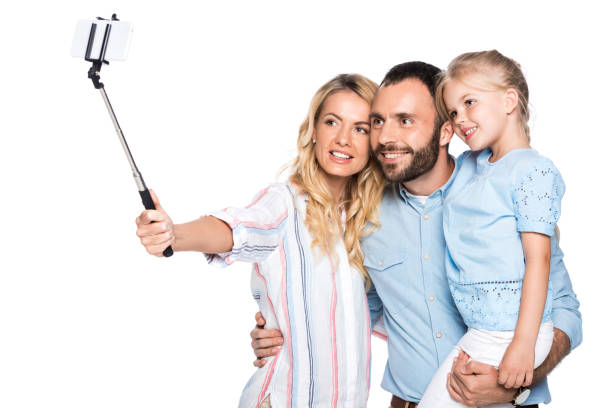 istock family taking selfie on smartphone isolated on white 1040903036