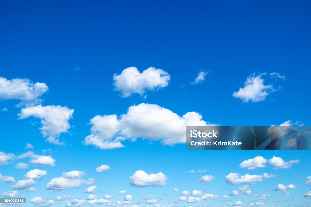 many little fluffy clouds in blue sky in sunny day many little fluffy clouds in blue sky in sunny september day Sky Stock Photo