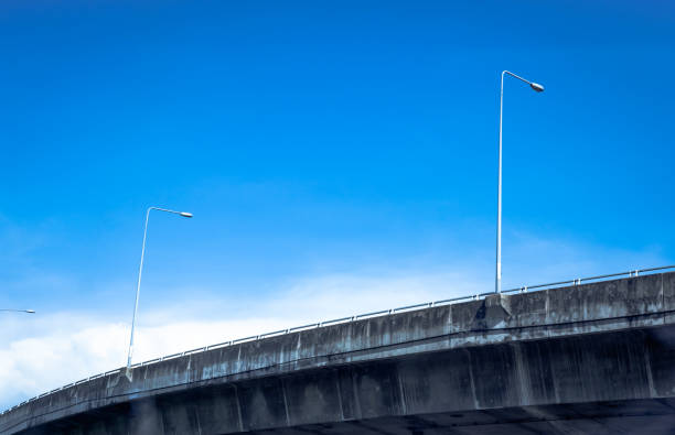 istock Electric pole on express way and blue sky 1040912396