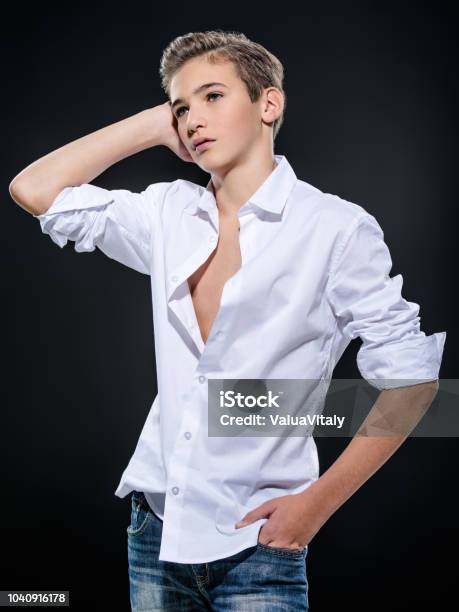 Photo Of Teenage Handsome Guy Posing At Studio Stock Photo - Download Image Now - 14-15 Years, Adolescence, Adult