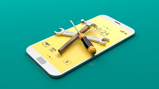 Tools on a smartphone on green background. 3d illustration