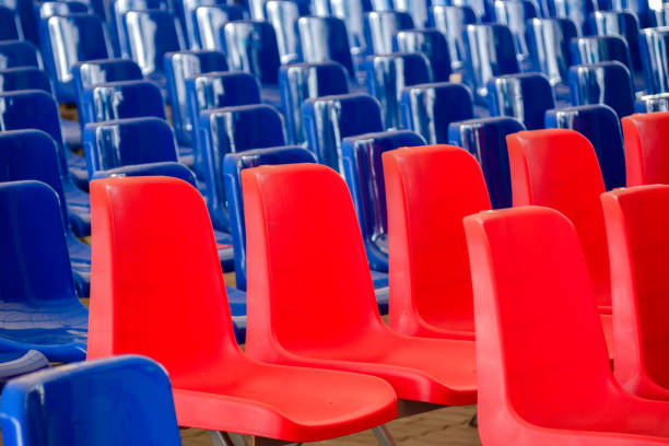 istock Rows Of Red And Blue Empty Plastic Seats At The Event. Blue Wave, Democratic Election Concept. 1040925768