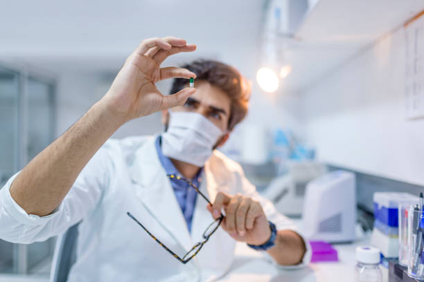 istock Closely looks into big transparent pill. 1040932308