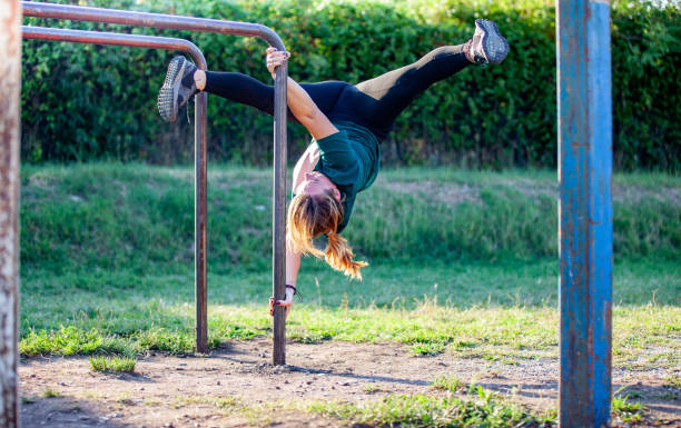 istock Young Woman Exercising Outdoors in Public Park 1040932636