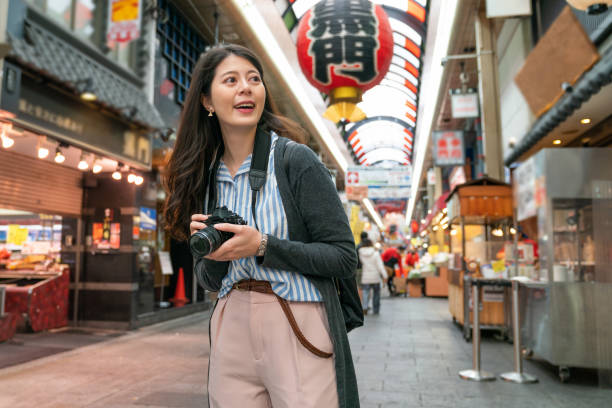 istock asian female visiting japanese market. 1040936336