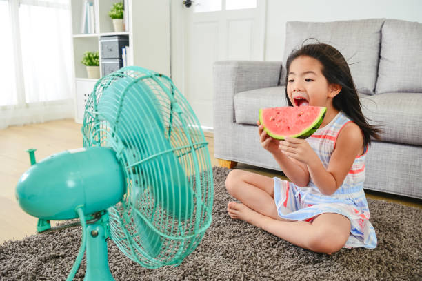 istock lovely girl eating melon with a big bite. 1040941044