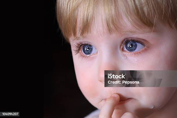 A Headshot Of A Baby Boy Who Has Tears Rolling Down His Face Stock Photo - Download Image Now