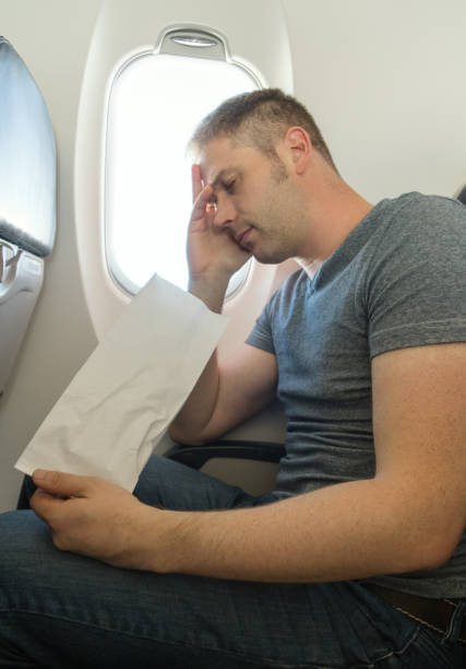 istock Airsickness. Man feels very bad on the plane. 1040944316