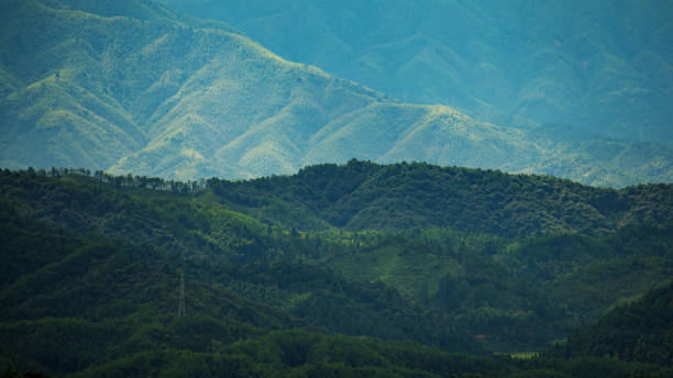 istock Mountain peak range landscape. Green mountain range view. Mountain peak blue sky white clouds panorama 1040955524
